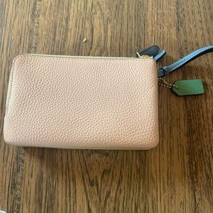Coach Wristlet. One side pink the other yellow with two pockets